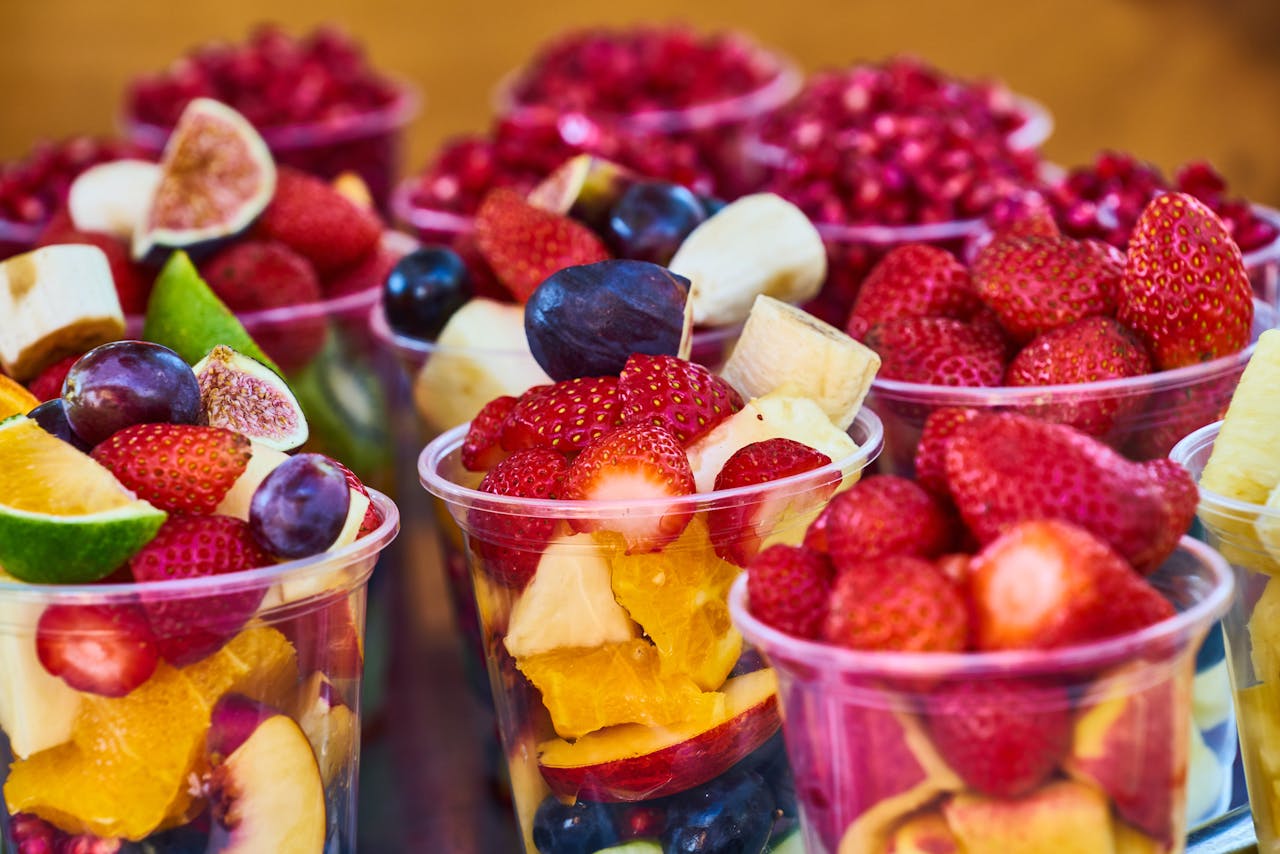 Vibrant and fresh fruit salad cups filled with assorted fruits, perfect for healthy eating.